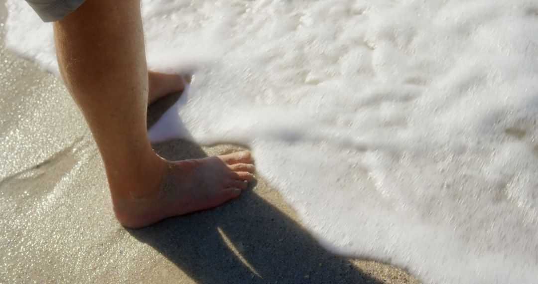 Senior Man Enjoying Sea Waves at Sandy Beach Shore