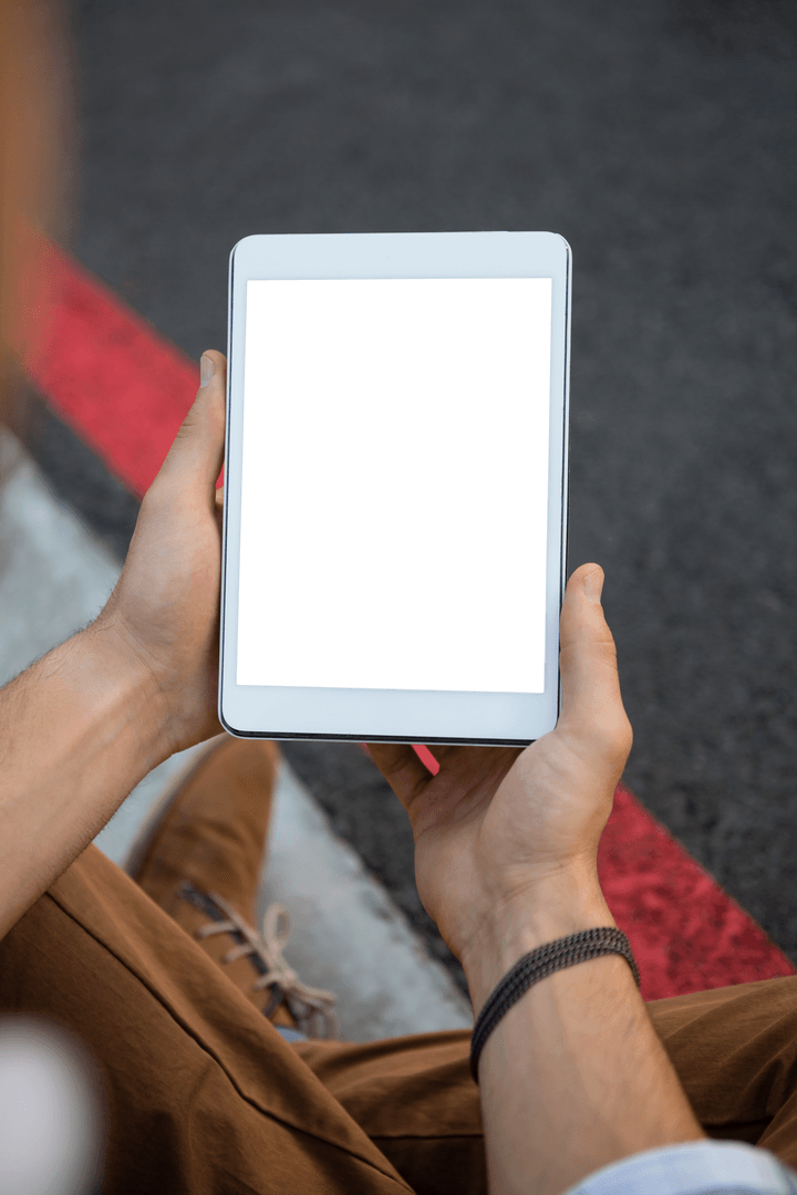 Transparent Tablet Screen in Urban Setting with Man Holding Device