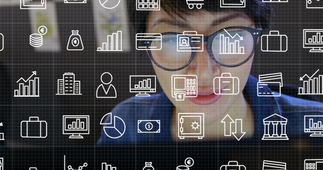 Asian Professional Analyzing Financial Data on Wireless Monitor