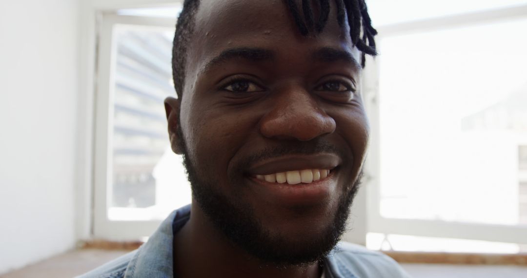 Close Up of Smiling Young African-American Man with Dreadlocks - Free Images, Stock Photos and Pictures on Pikwizard.com