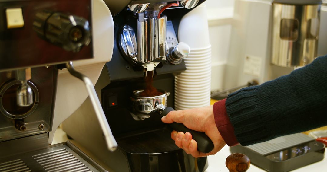 Barista Making Espresso with Coffee Machine in Cafe - Free Images, Stock Photos and Pictures on Pikwizard.com