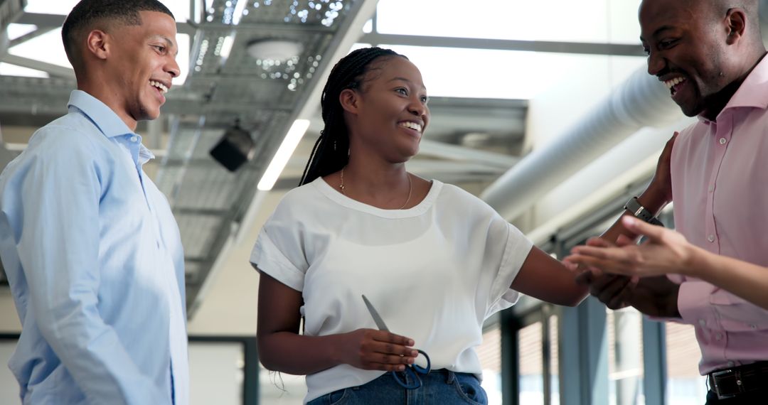 Diverse Team Celebrating New Project Launch in Office