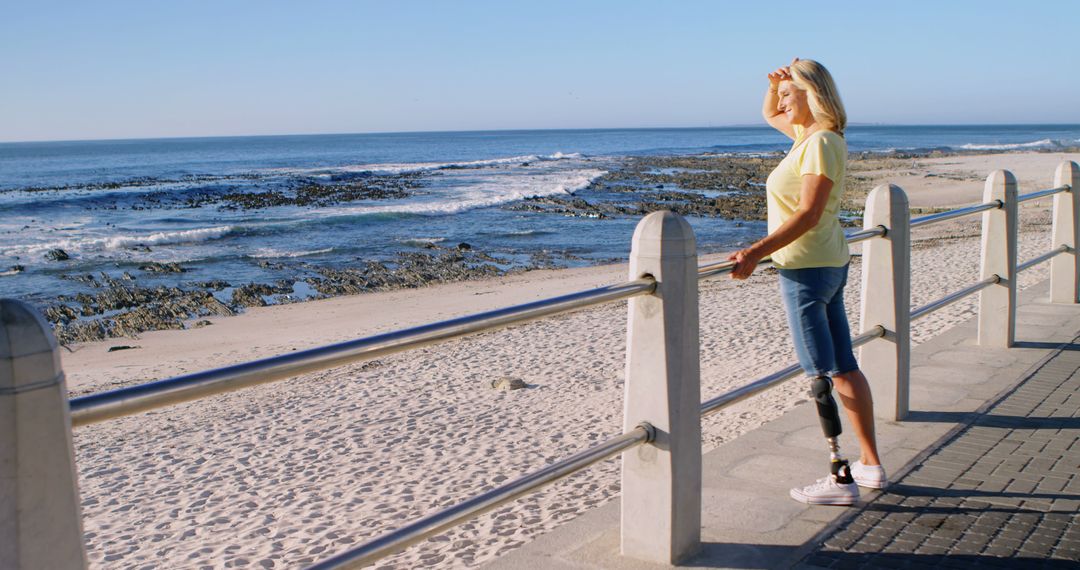 Active Senior Woman with Prosthetic Leg Enjoying Oceanview - Free Images, Stock Photos and Pictures on Pikwizard.com