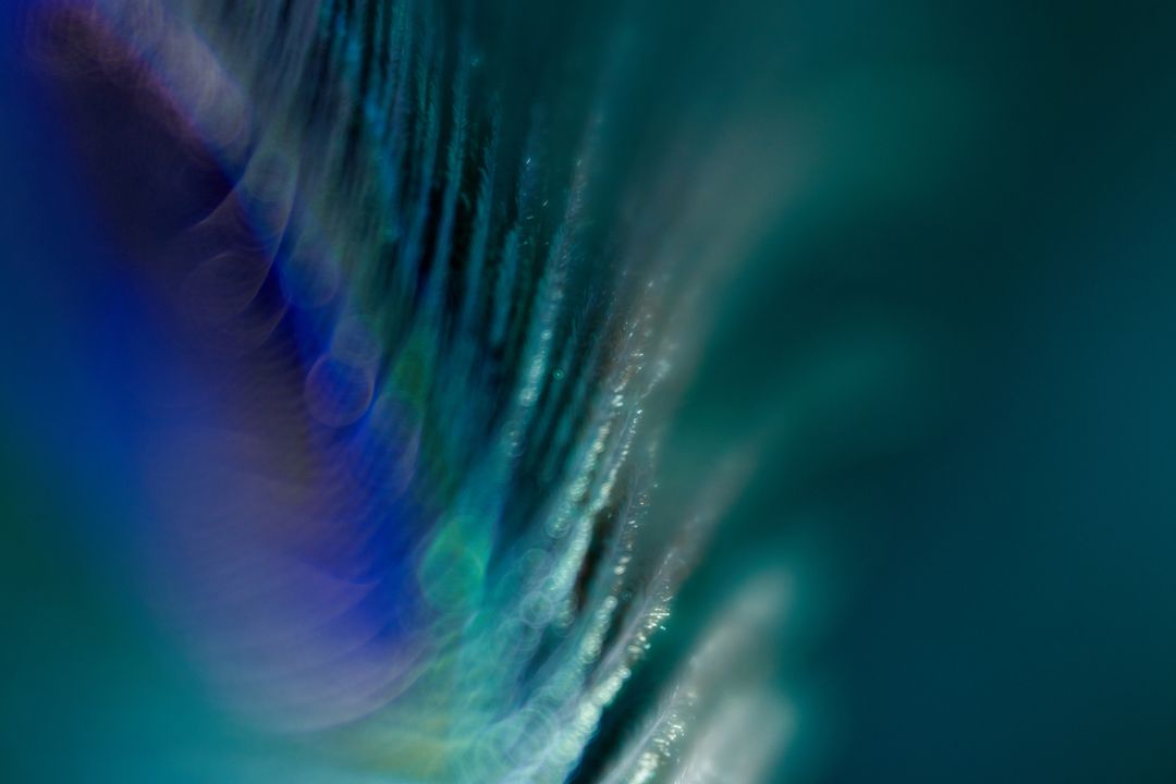 Vibrant Abstract Close-Up with Blue-Green Hues & Textural Flow