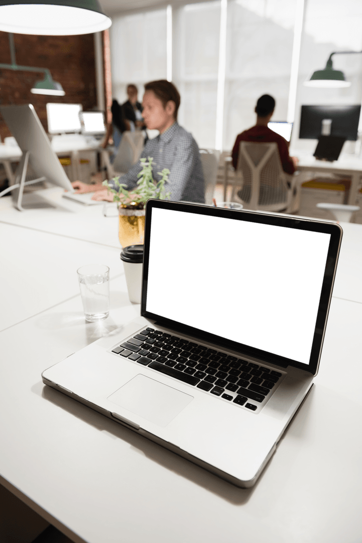 Open Laptop with Blank Screen in Busy Office on Transparent Background