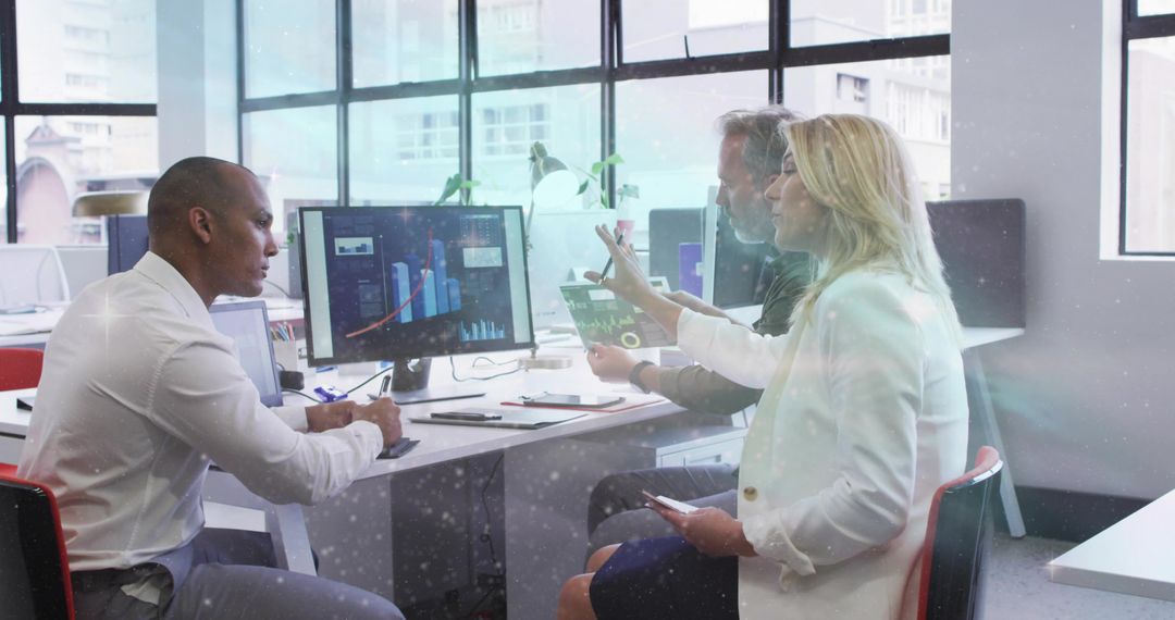 Business Team Collaborating on Data Analysis in Office