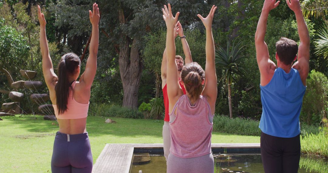 Group Yoga Session in Sunny Park by Water Feature