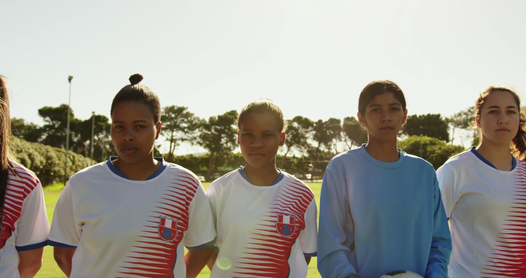 Diverse Women's Soccer Team Posing for Group Portrait on Field - Free Images, Stock Photos and Pictures on Pikwizard.com