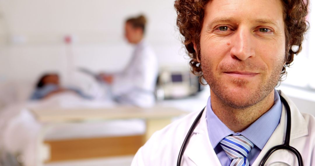 Confident Male Doctor with Stethoscope in Hospital Setting - Free Images, Stock Photos and Pictures on Pikwizard.com