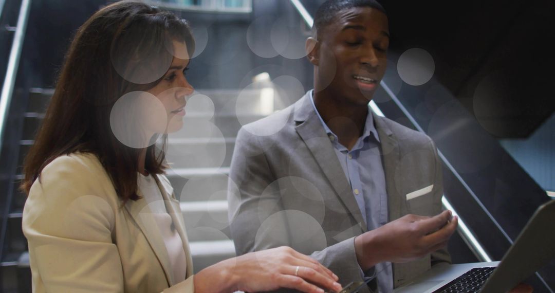 Business Professionals Discussing Projects on Staircase