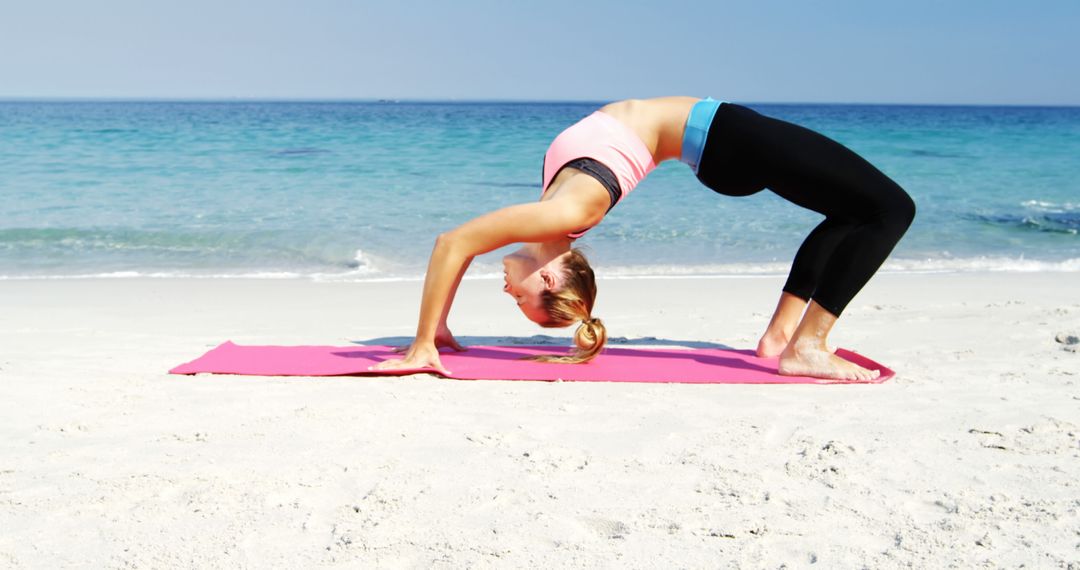 Woman Practicing Yoga on Beach in Wheel Pose - Free Images, Stock Photos and Pictures on Pikwizard.com