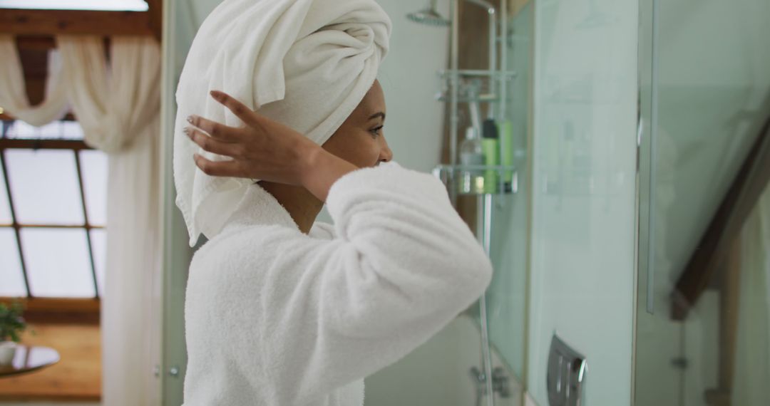 Smiling Woman in Bathrobe and Towel Turban in Bathroom - Free Images, Stock Photos and Pictures on Pikwizard.com