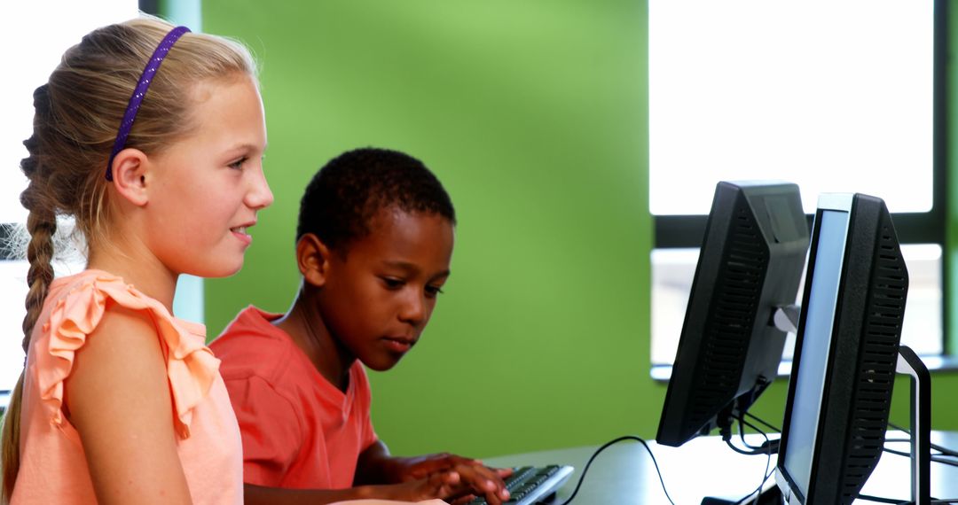 Children Learning on Computers in Classroom with Green Wall - Free Images, Stock Photos and Pictures on Pikwizard.com