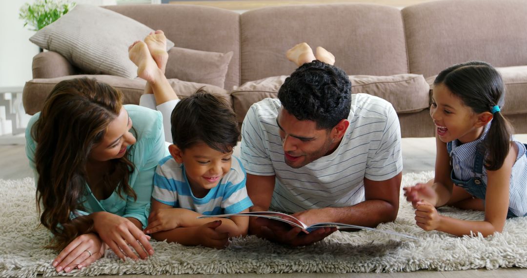 Happy Family Reading Book Together on Living Room Floor - Free Images, Stock Photos and Pictures on Pikwizard.com