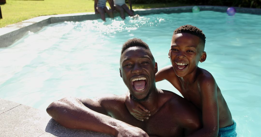 Father and Son Bonding in Pool During Summer
