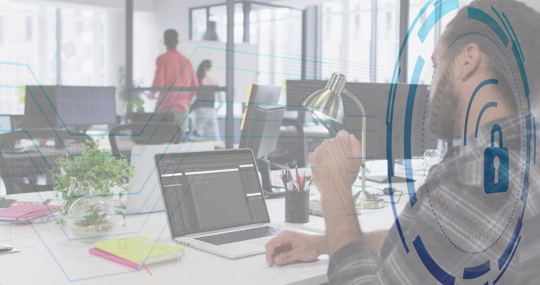 Bearded developer coding on laptop in open office with security overlay and copy space