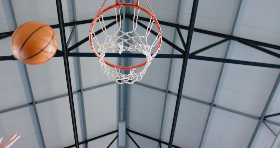 Basketball Shot in Motion Toward Net in Indoor Gym