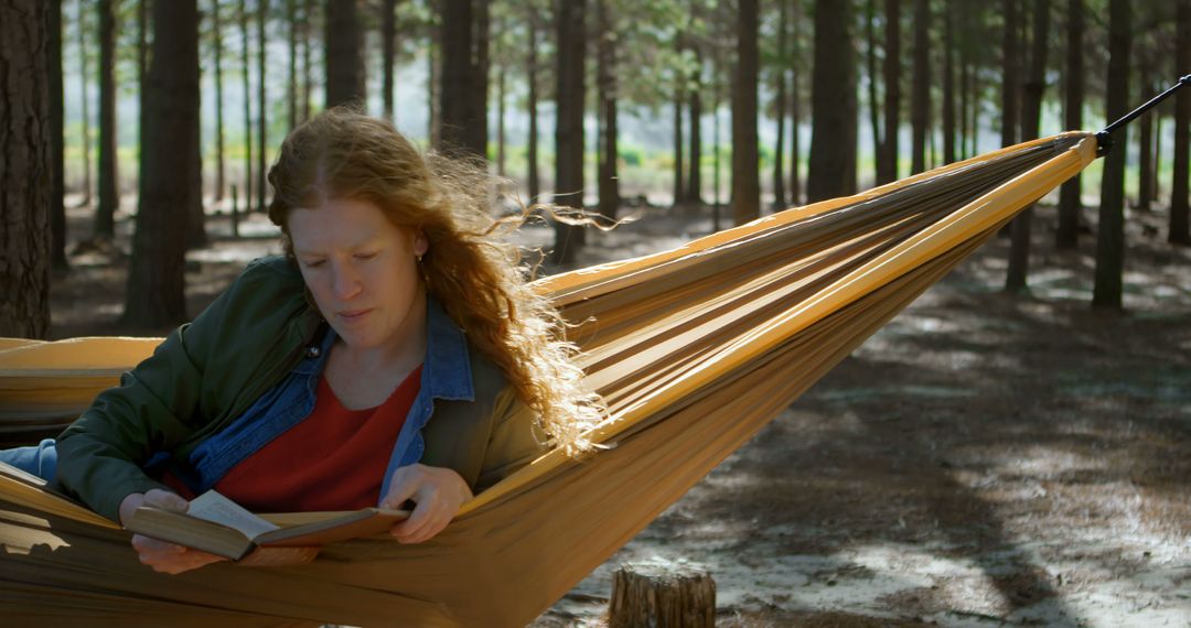 Woman Reading Book in Hammock in Tranquil Forest - Free Images, Stock Photos and Pictures on Pikwizard.com