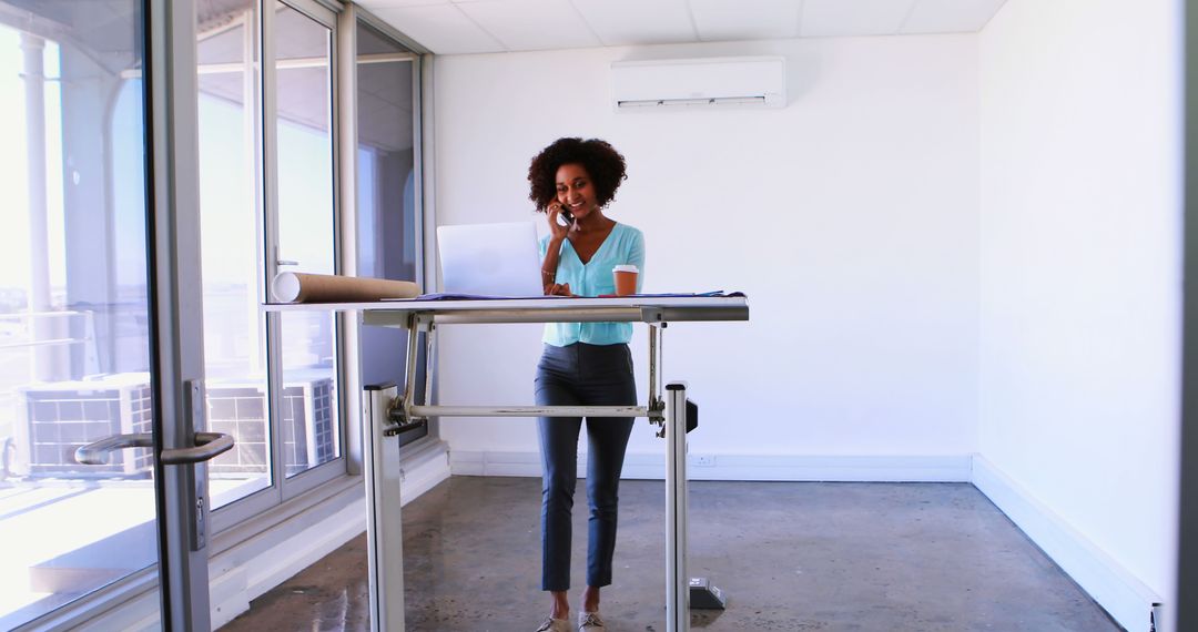 Architect Working at Standing Desk in Modern Office - Free Images, Stock Photos and Pictures on Pikwizard.com