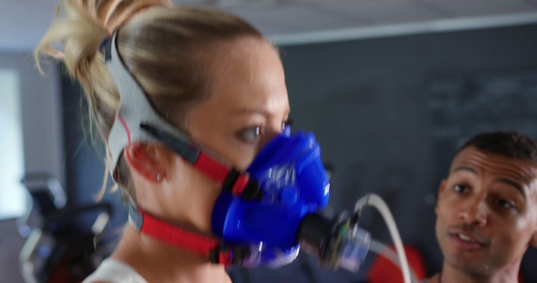 Woman Experiencing Advanced Fitness Testing in Gym with Trainer