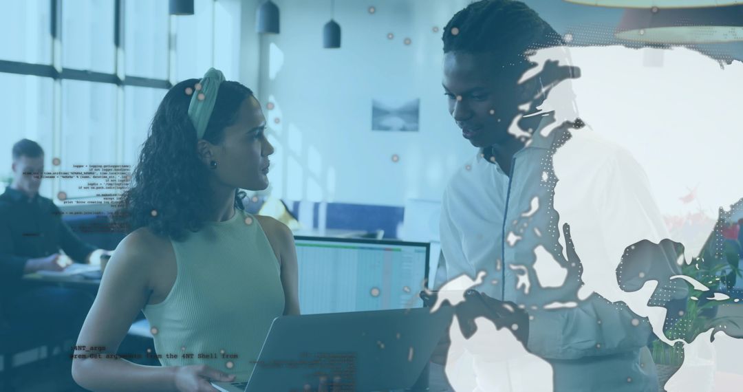 Colleagues Collaborating in Modern Open-Plan Office Setting