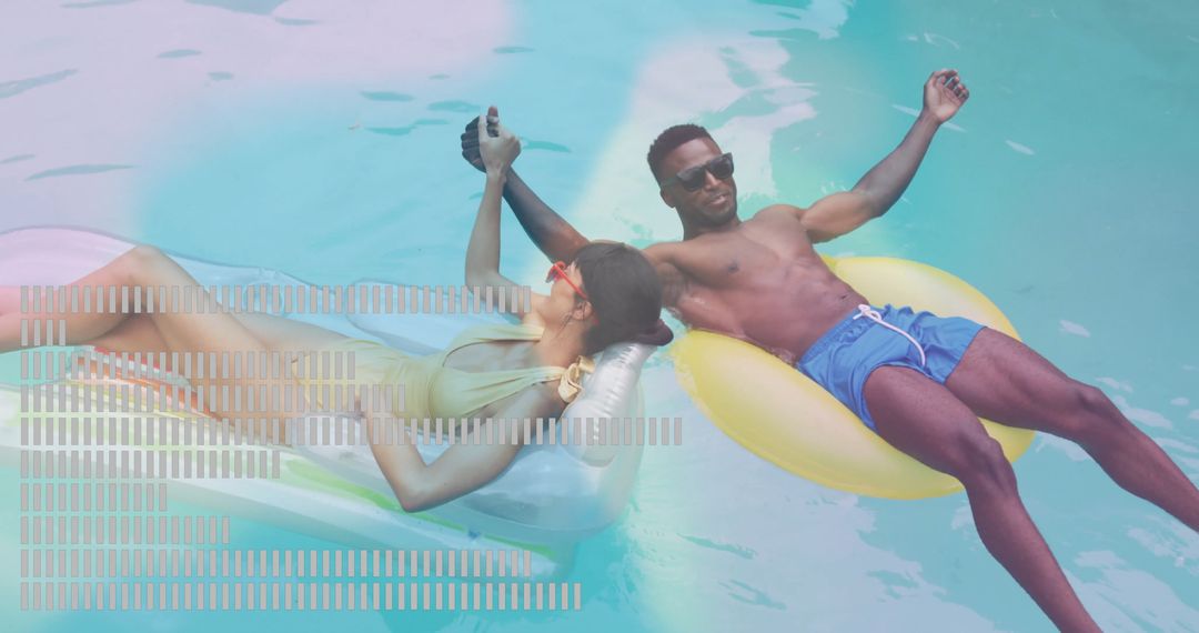 Relaxed Couple Floating on Inflatable Rings in Pool
