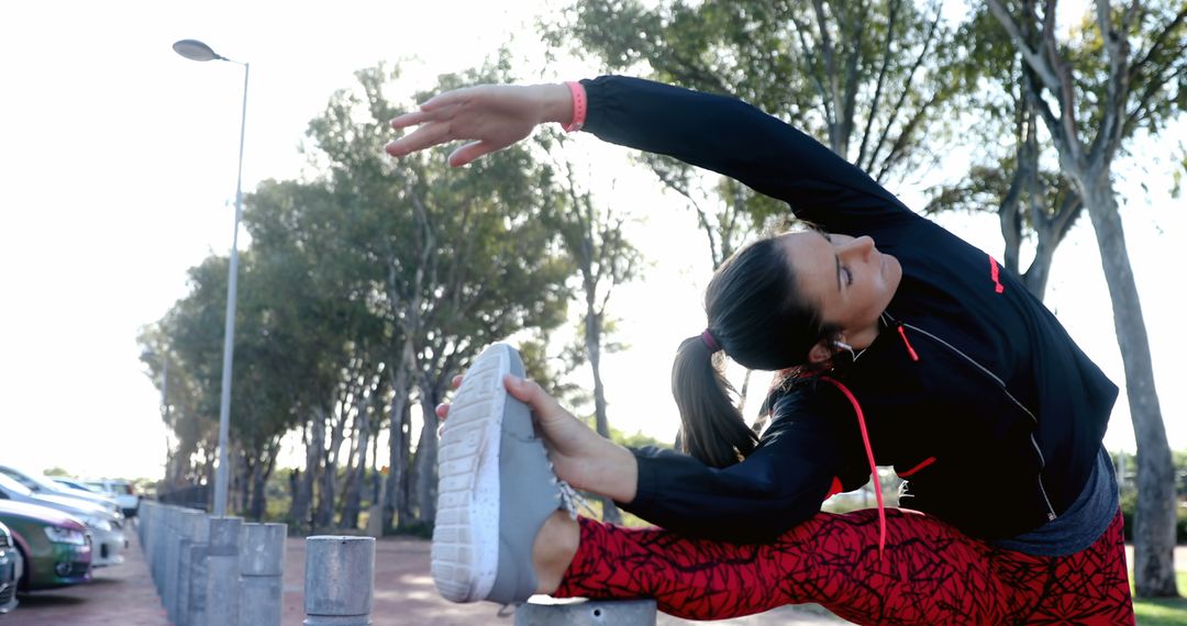 Woman Stretching Leg in Outdoor Parking Lot - Free Images, Stock Photos and Pictures on Pikwizard.com