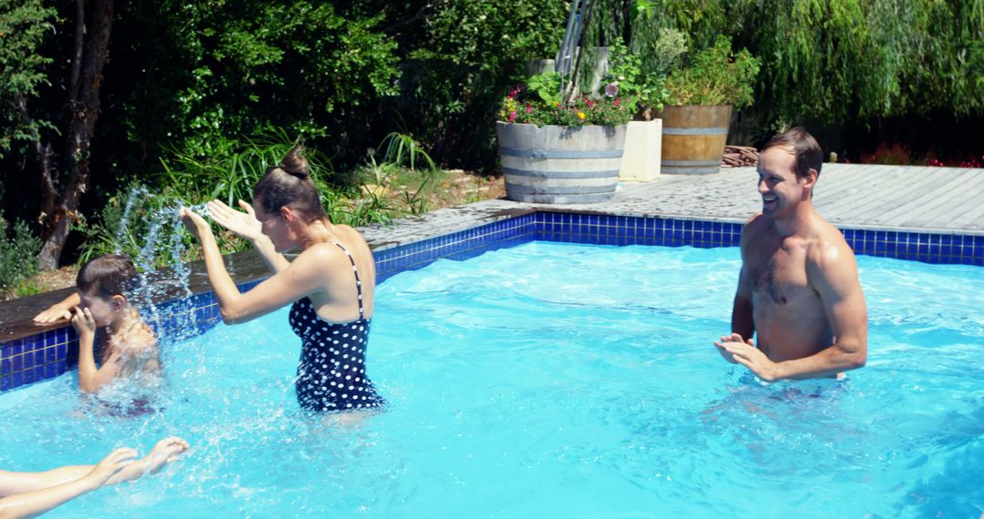 Happy Family Enjoying Fun Time in Swimming Pool Outdoors - Free Images, Stock Photos and Pictures on Pikwizard.com