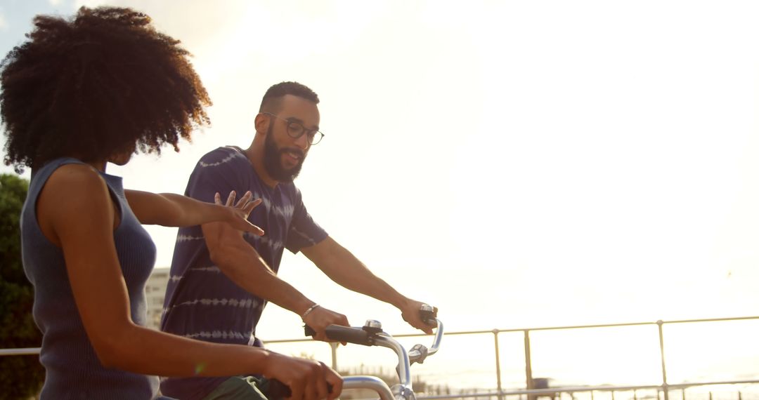 African American Couple Enjoying Bike Ride Together at Sunset - Free Images, Stock Photos and Pictures on Pikwizard.com