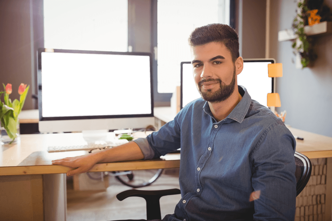 Confident Young Designer in Modern Office with Transparent Computer Screens