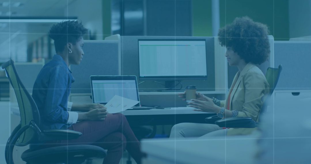 Colleagues Exchanging Feedback in Modern Professional Workspace