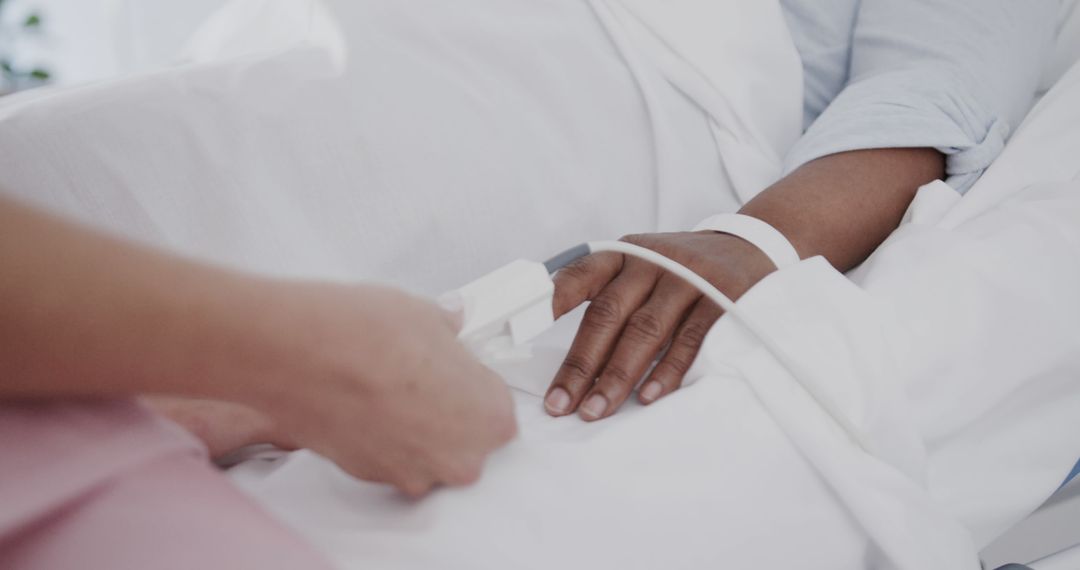 Closeup of Patient's Hand with Pulse Oximeter in Hospital Bed - Free Images, Stock Photos and Pictures on Pikwizard.com