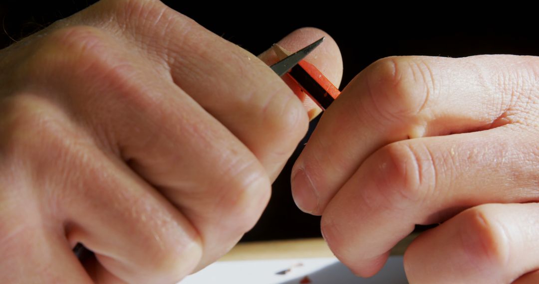 Hands Removing Bandage from Finger with Care