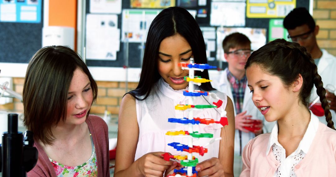 Diverse Students Exploring DNA Model in Science Classroom - Free Images, Stock Photos and Pictures on Pikwizard.com