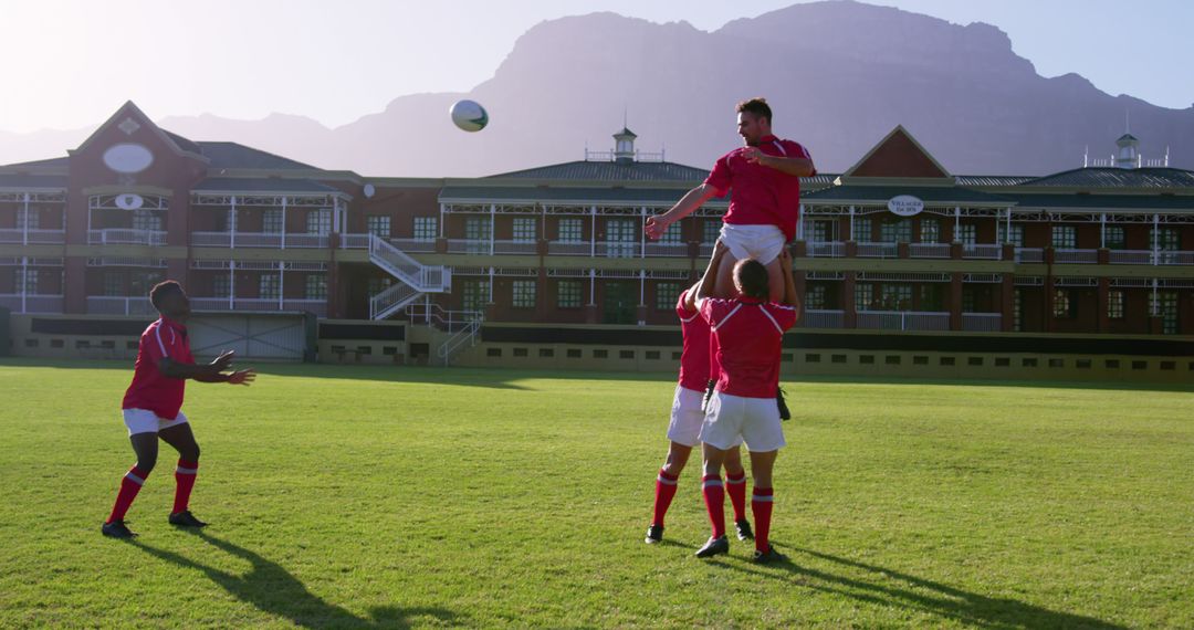 Rugby Players Practicing Lineout Against Scenic Mountains - Free Images, Stock Photos and Pictures on Pikwizard.com