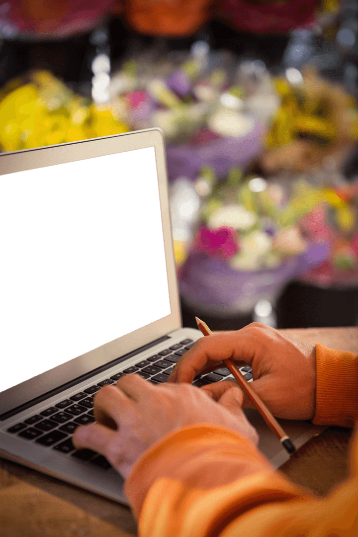 Transparent Laptop Screen, Hands Typing Keyboard in Vibrant Flower Shop