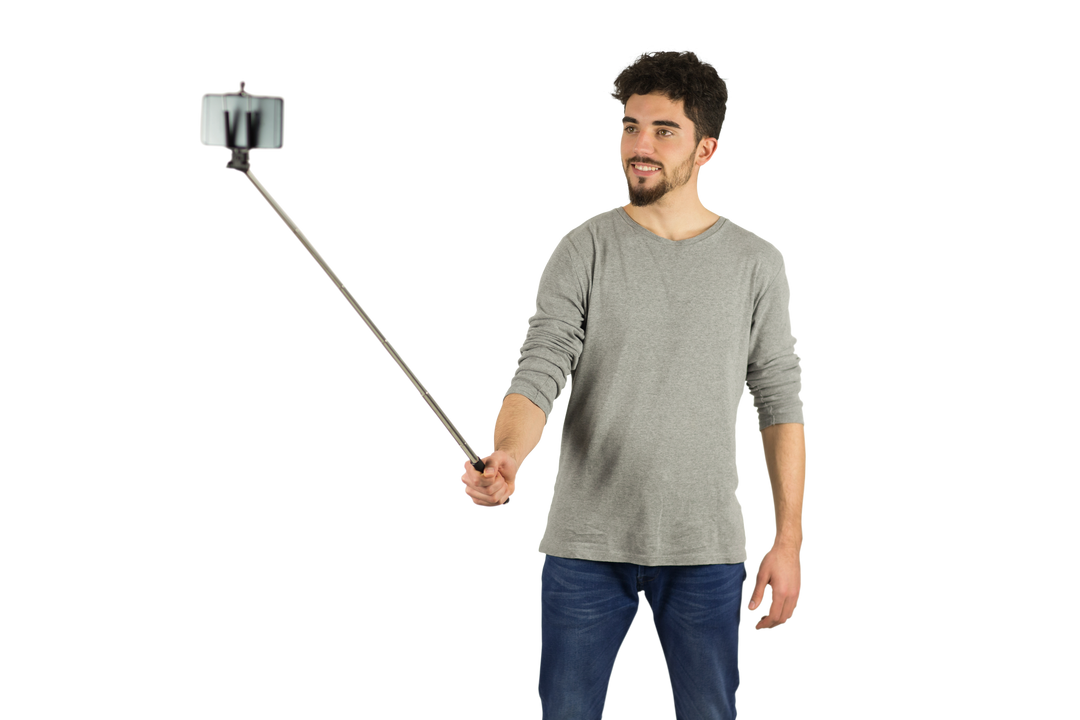 Casual Man Using Transparent Selfie Stick in Studio - Download Free Stock Images Pikwizard.com