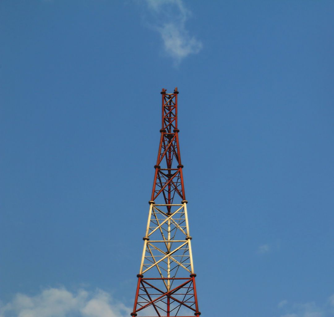 Communications Tower Against Clear Blue Sky - Free Images, Stock Photos and Pictures on Pikwizard.com
