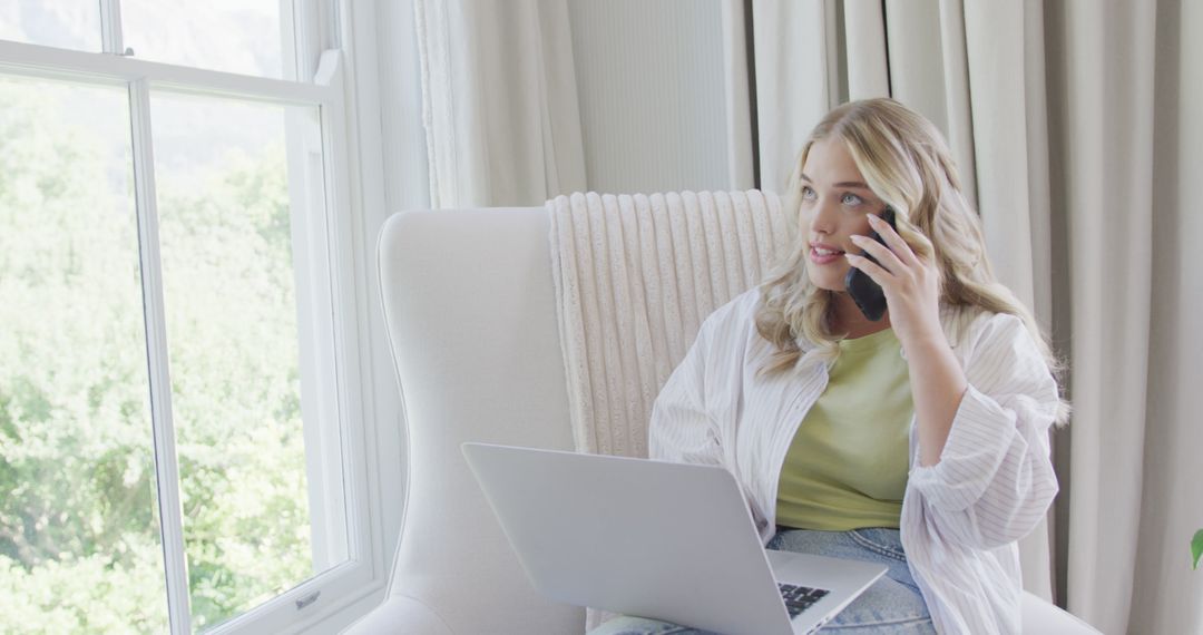 Woman Working from Home, Talking on Phone and Using Laptop - Free Images, Stock Photos and Pictures on Pikwizard.com