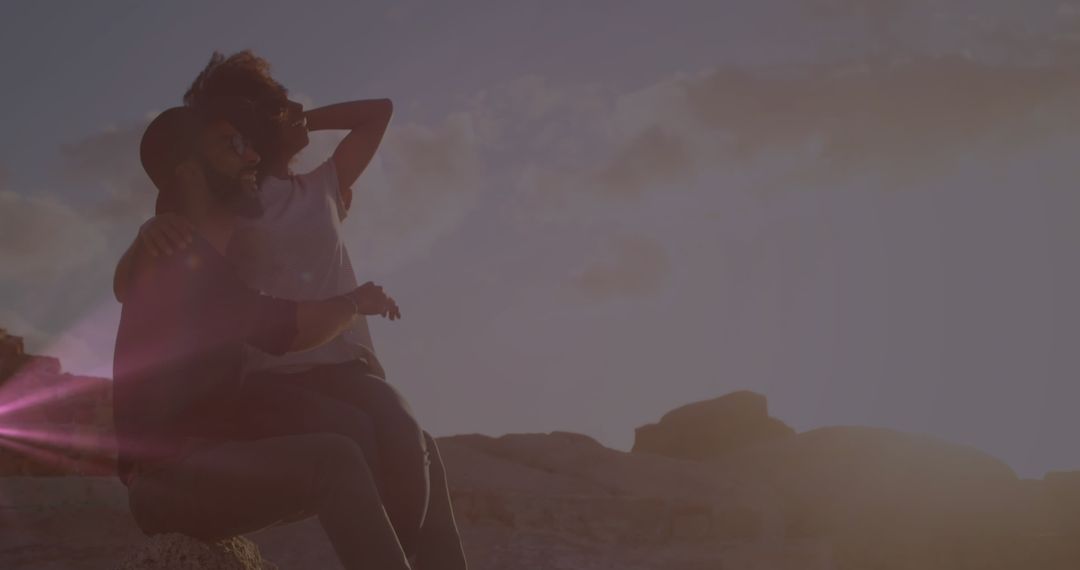 Couple Enjoying Sunset in Scenic Outdoor Setting - Free Images, Stock Photos and Pictures on Pikwizard.com