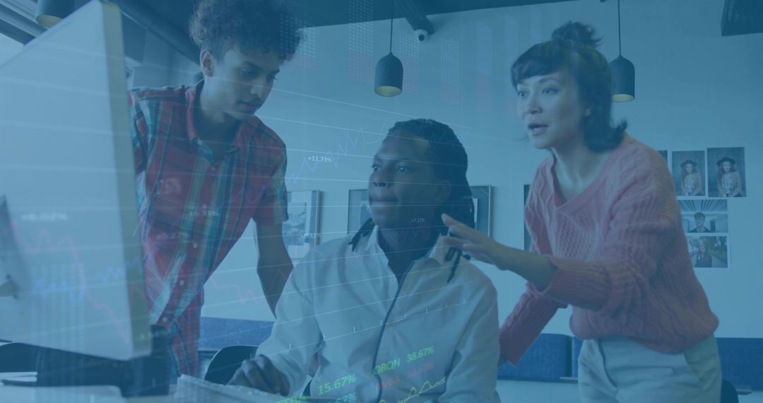 Focused Coworkers Reviewing Project on Computer in Modern Office