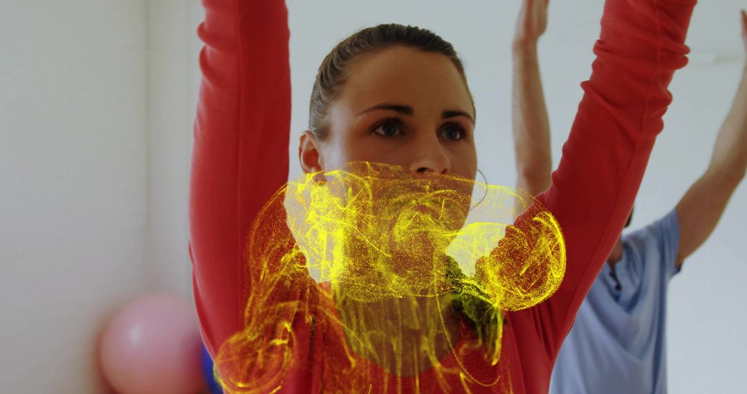 Woman Stretching with Abstract Yellow Light Effect in Motion Studio