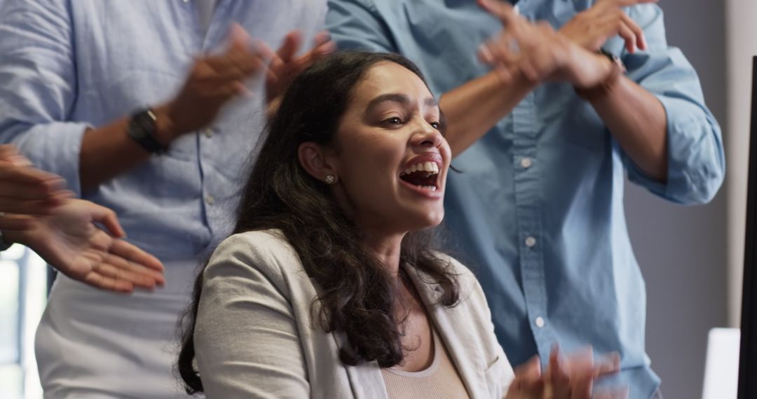 Happy Team Celebrating Success in Office Environment