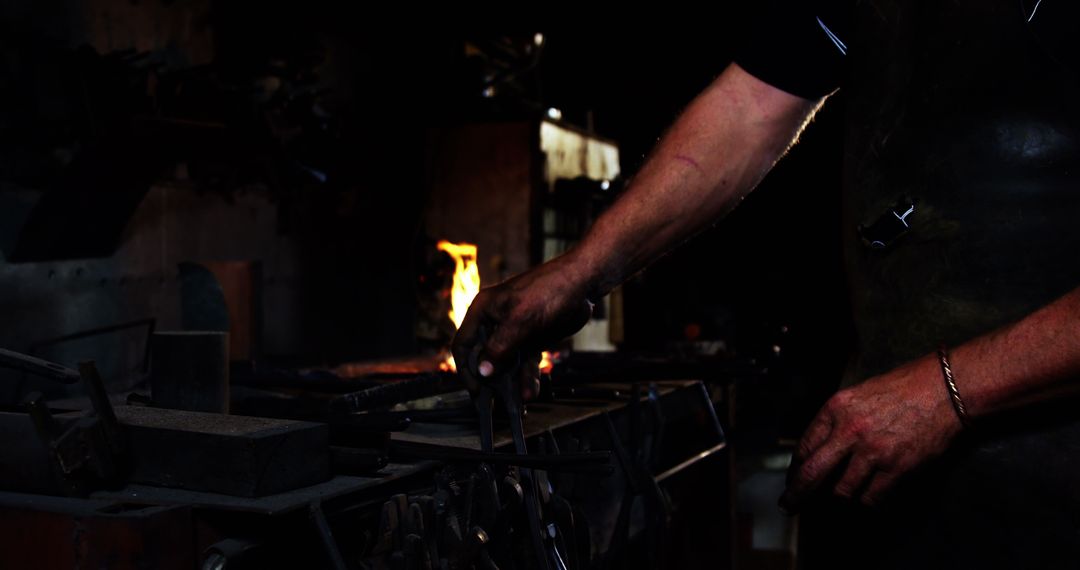 Close-up of Blacksmith Working with Metal in Forging Workshop - Free Images, Stock Photos and Pictures on Pikwizard.com