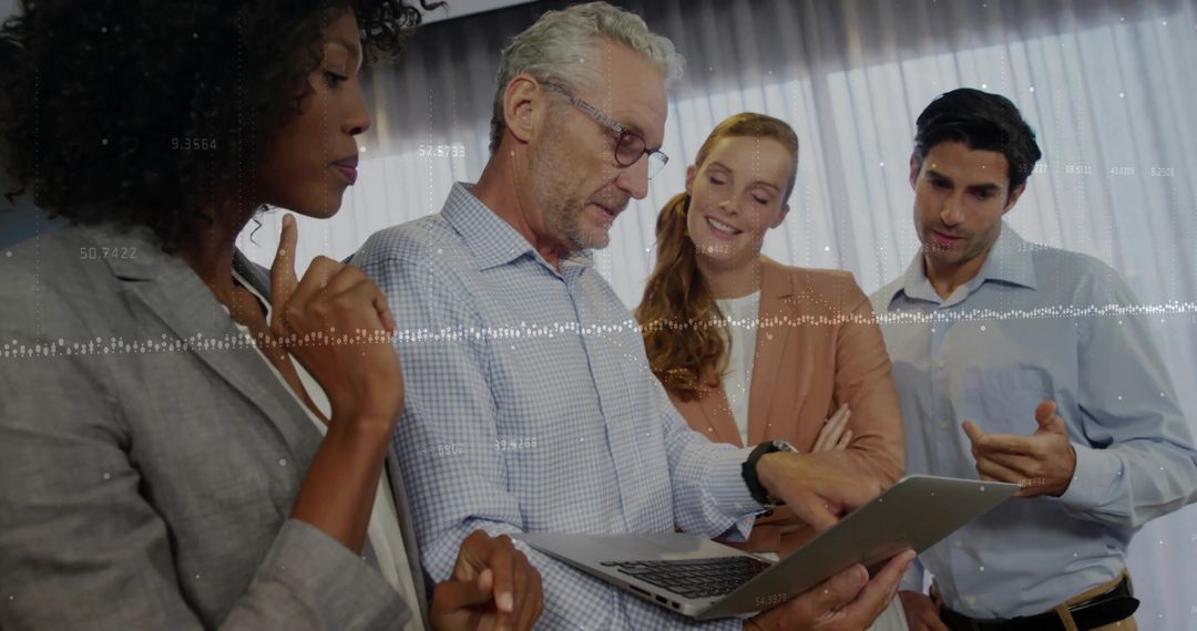 Diverse Business Team Collaborating With Digital Insights