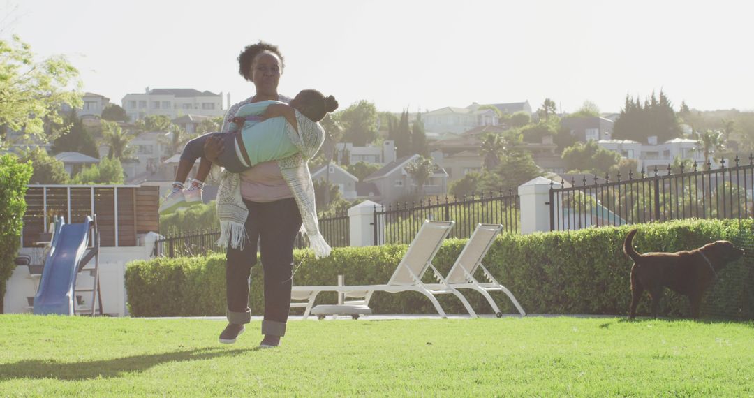 Image of happy african american grandmother carrying granddaughter, playing in park, copy space - Free Images, Stock Photos and Pictures on Pikwizard.com