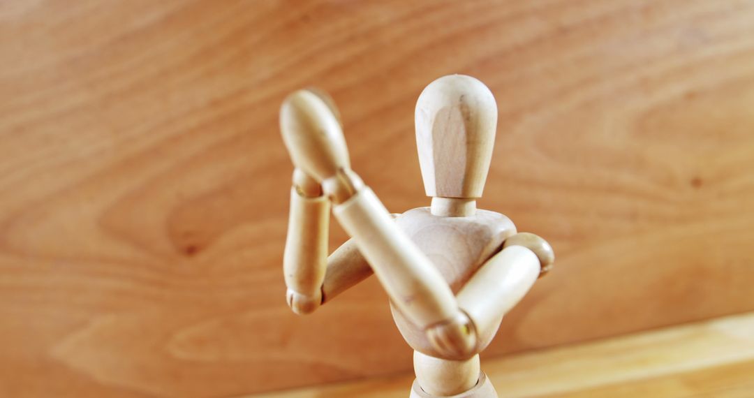 Wooden Artist Mannequin with Crossed Arms in Defensive Pose - Free Images, Stock Photos and Pictures on Pikwizard.com