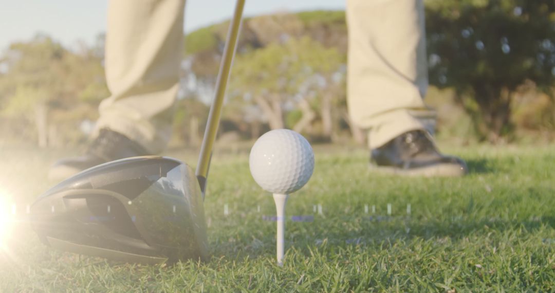Senior Golfer Preparing to Tee Off on Sunny Day