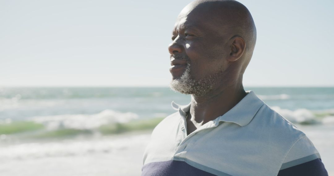 Contemplative Man at Beach with Ocean in Background - Free Images, Stock Photos and Pictures on Pikwizard.com