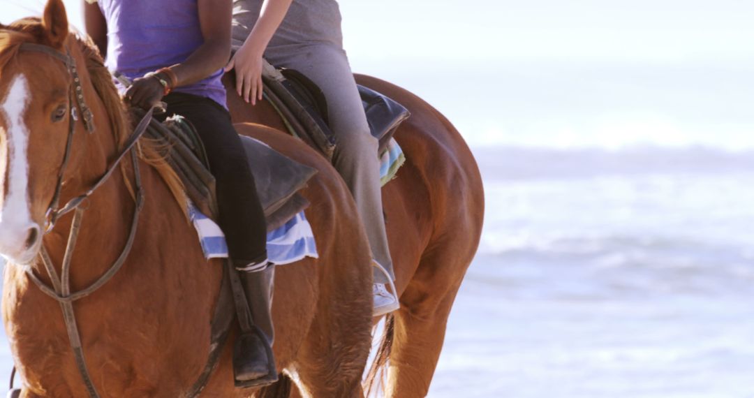 Friends Enjoying Horseback Riding on Beach - Free Images, Stock Photos and Pictures on Pikwizard.com